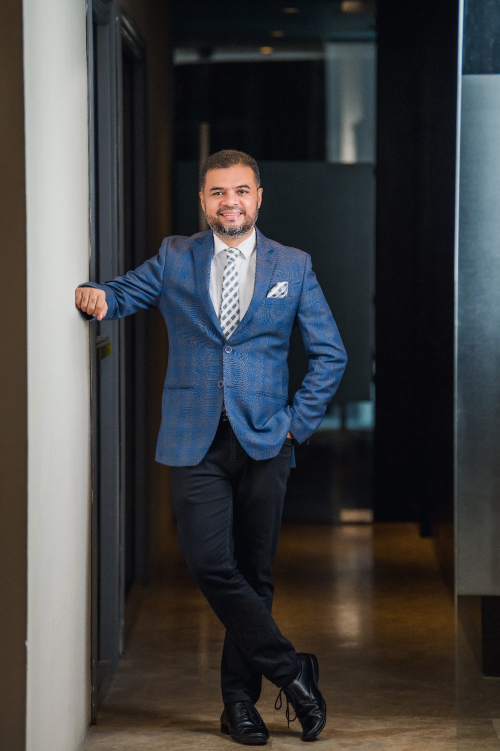 Muhammed Mehdi Hasan Chowdhury in a corporate hallway portrait